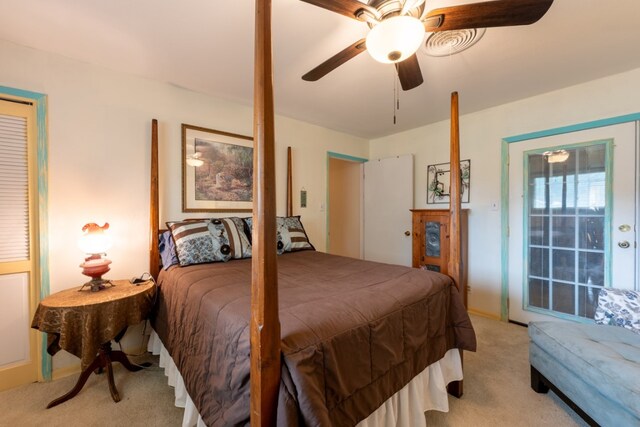 507 Flamingo Cir, Marble Falls, TX 78654 - bedroom with light colored carpet and a ceiling fan