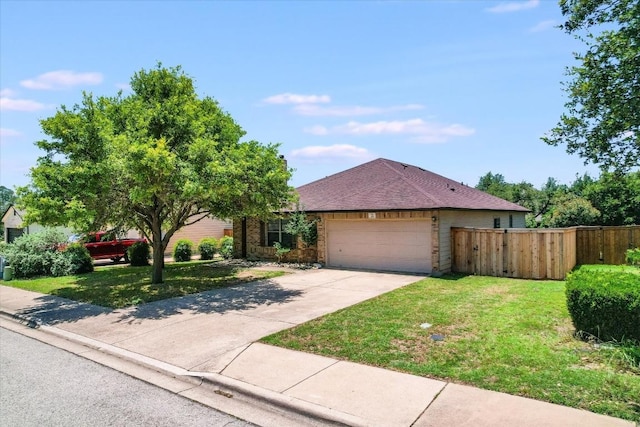 301 Wildwood Dr, Georgetown, TX 78633 - ranch-style home featuring an attached garage, concrete driveway, and a shingled roof