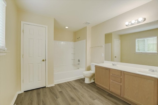 301 Wildwood Dr, Georgetown, TX 78633 - bathroom with wood finished floors, double vanity, and shower / washtub combination