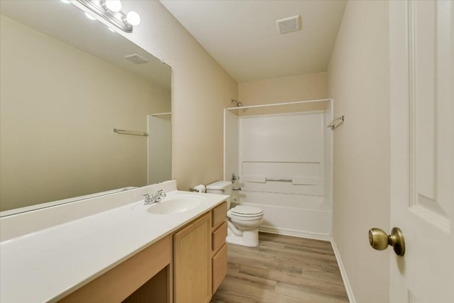 301 Wildwood Dr, Georgetown, TX 78633 - full bath featuring vanity, wood finished floors, and bathing tub / shower combination