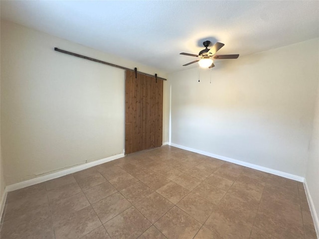 4503 E Stassney Ln, Austin, TX 78744 - empty room featuring a barn door and a ceiling fan