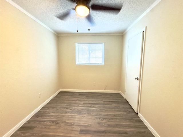 4503 E Stassney Ln, Austin, TX 78744 - empty room with ornamental molding, a textured ceiling, dark wood-type flooring, and a ceiling fan
