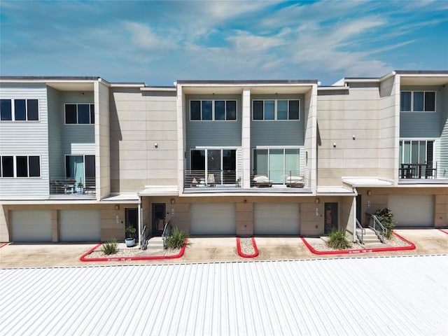 604 N Bluff Dr Unit 247, Austin, TX 78745 - rear view of house featuring an attached garage