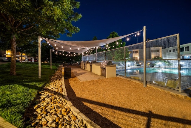 604 N Bluff Dr Unit 247, Austin, TX 78745 - view of property's community with an outdoor kitchen and a pool