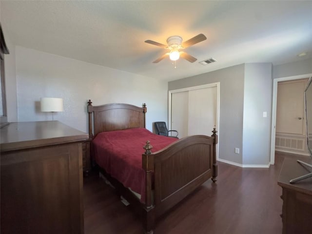 551 Abundance Ln, Kyle, TX 78640 - bedroom featuring dark wood-style floors, a closet, and ceiling fan