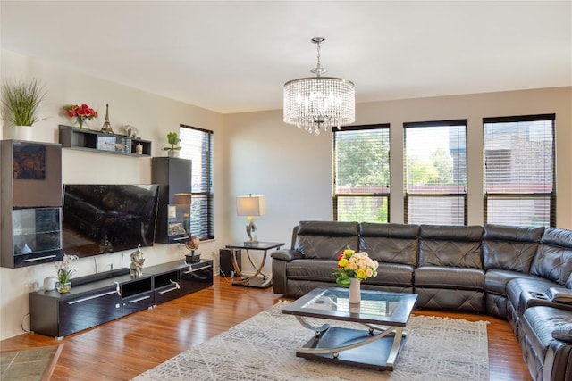1529 Gautami Dr, Austin, TX 78753 - living room featuring a chandelier and wood finished floors