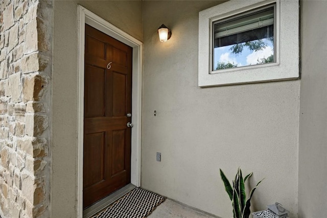 1115 Kinney Ave Unit 6, Austin, TX 78704 - view of exterior entry featuring stucco siding and stone siding