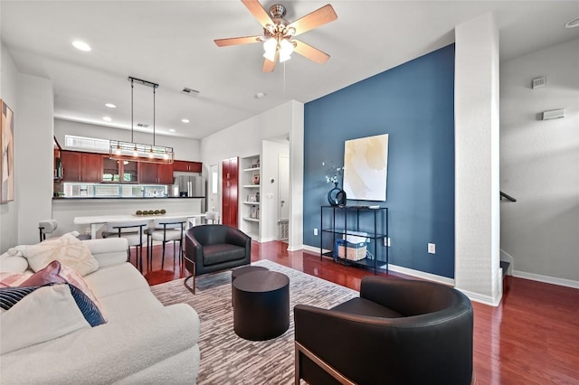 1115 Kinney Ave Unit 6, Austin, TX 78704 - living room featuring dark wood finished floors, a ceiling fan, built in shelves, and recessed lighting