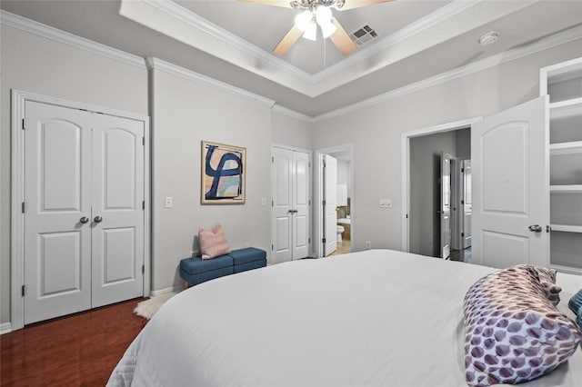 1115 Kinney Ave Unit 6, Austin, TX 78704 - bedroom featuring multiple closets, crown molding, a raised ceiling, and a ceiling fan