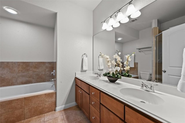1115 Kinney Ave Unit 6, Austin, TX 78704 - bathroom with double vanity, tile patterned flooring, a garden tub, and an enclosed shower