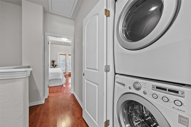 1115 Kinney Ave Unit 6, Austin, TX 78704 - laundry area featuring stacked washer / dryer, attic access, and dark wood-type flooring
