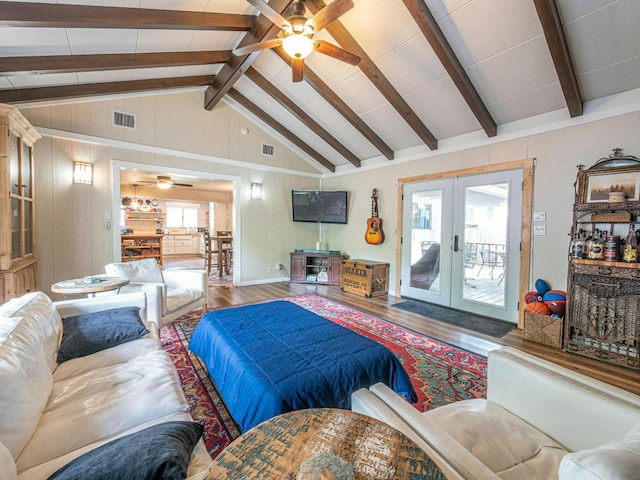 6801 Bryn Mawr Dr, Austin, TX 78723 - living area with wood finished floors, french doors, a ceiling fan, and wood walls