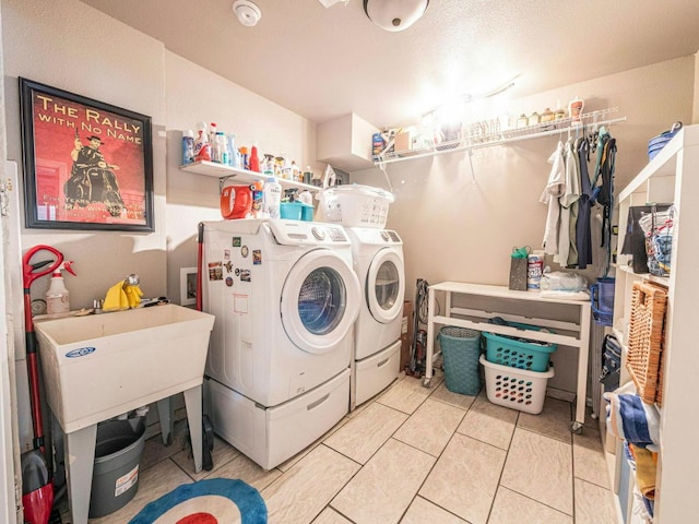 6801 Bryn Mawr Dr, Austin, TX 78723 - washroom with washer and clothes dryer and tile patterned flooring