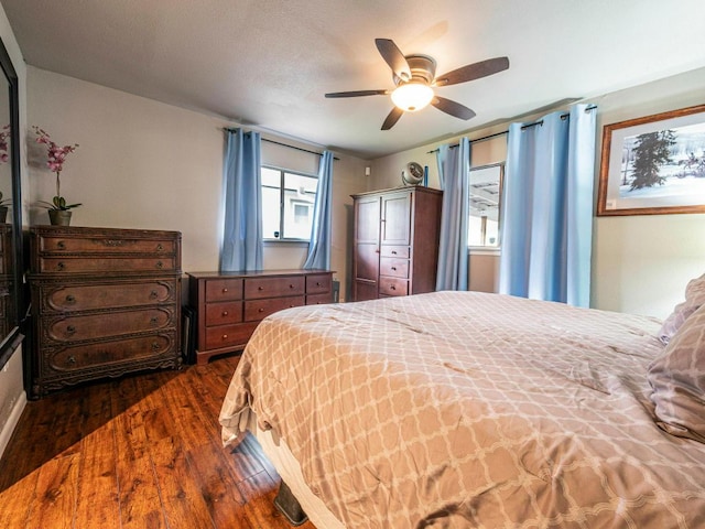 6801 Bryn Mawr Dr, Austin, TX 78723 - bedroom featuring dark wood-type flooring and ceiling fan