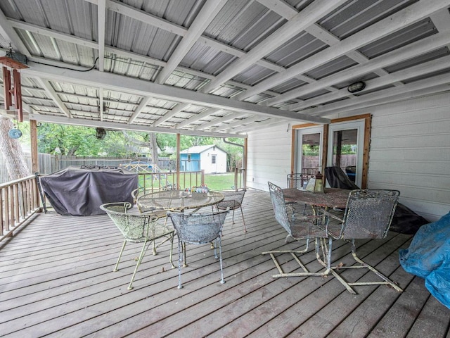 6801 Bryn Mawr Dr, Austin, TX 78723 - deck featuring outdoor dining space, a storage shed, and a grill