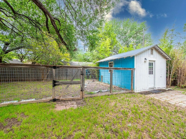 6801 Bryn Mawr Dr, Austin, TX 78723 - view of yard with a gate and an outdoor structure