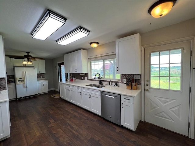 2120 Fm 1704, Elgin, TX 78621 - kitchen with white fridge with ice dispenser, dishwasher, tasteful backsplash, light countertops, and dark wood-type flooring