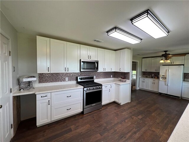 2120 Fm 1704, Elgin, TX 78621 - kitchen with stainless steel appliances, dark wood-style flooring, tasteful backsplash, light countertops, and a ceiling fan
