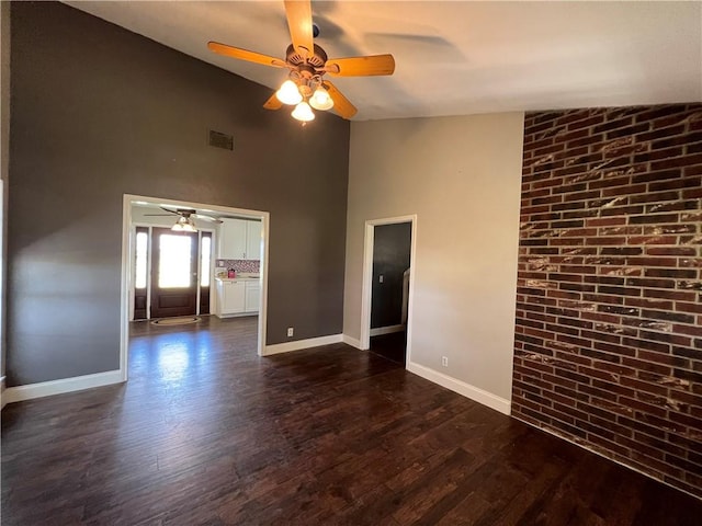 2120 Fm 1704, Elgin, TX 78621 - spare room with a ceiling fan, high vaulted ceiling, and dark wood-style floors