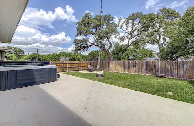 261 Deserti Rd, Leander, TX 78641 - fenced backyard featuring a hot tub and a patio