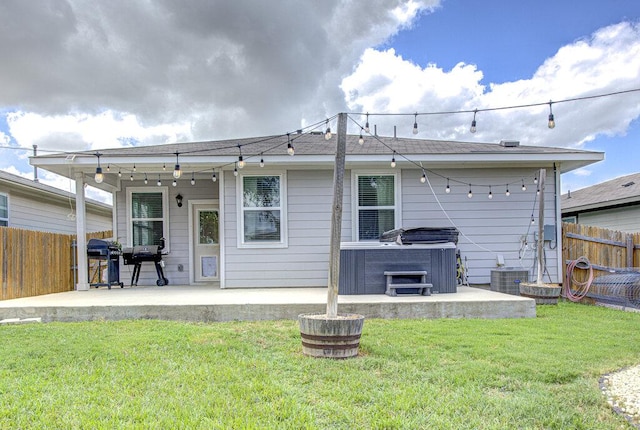 261 Deserti Rd, Leander, TX 78641 - back of property featuring a hot tub and a patio