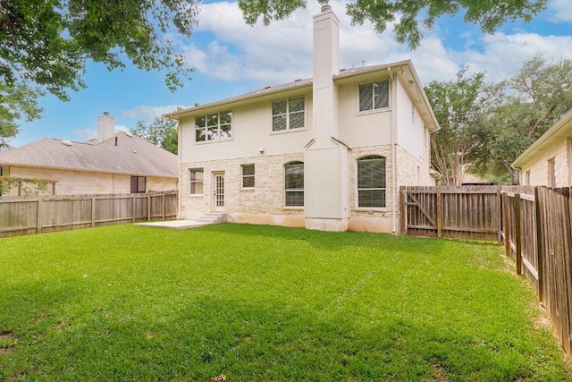 15213 Mallard Green Ln, Austin, TX 78728 - back of property featuring a fenced backyard, a chimney, and a patio