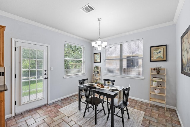 15213 Mallard Green Ln, Austin, TX 78728 - dining area featuring brick flooring, a chandelier, and ornamental molding