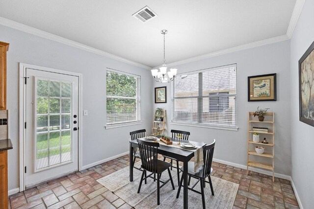 15213 Mallard Green Ln, Austin, TX 78728 - dining space with brick flooring, ornamental molding, and a chandelier