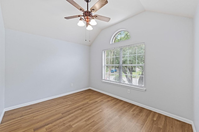 15213 Mallard Green Ln, Austin, TX 78728 - spare room with lofted ceiling, wood finished floors, and a ceiling fan