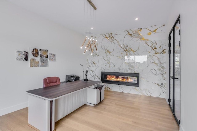 1806 Lauren Dr, Spicewood, TX 78669 - office space featuring a premium fireplace, light wood finished floors, recessed lighting, and an accent wall
