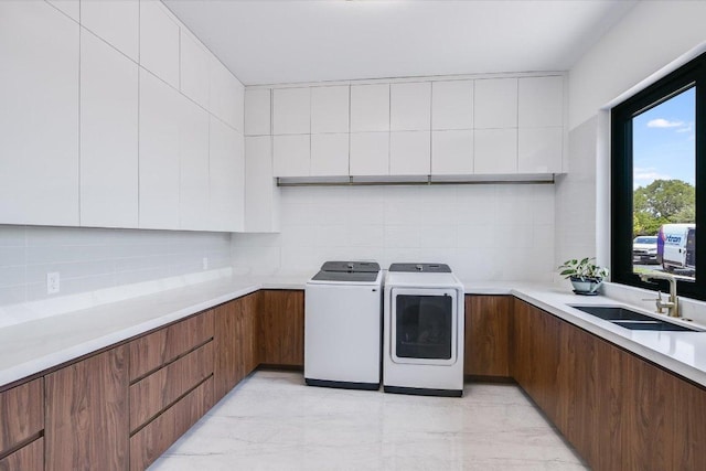 1806 Lauren Dr, Spicewood, TX 78669 - washroom featuring independent washer and dryer and cabinet space