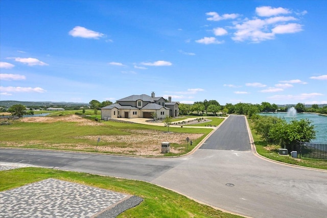 1806 Lauren Dr, Spicewood, TX 78669 - view of asphalt street with curbs and a water view
