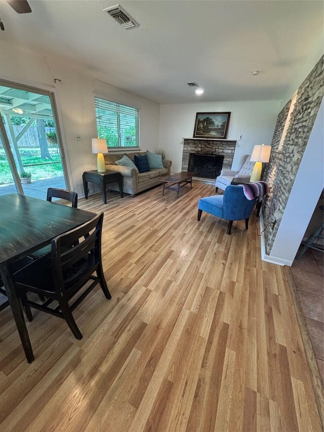3205 Whites Dr, Austin, TX 78735 - living area with a fireplace and light wood-style floors