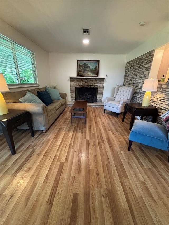 3205 Whites Dr, Austin, TX 78735 - living area featuring light wood finished floors and a stone fireplace