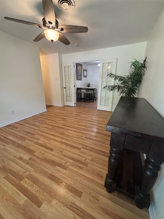 3205 Whites Dr, Austin, TX 78735 - living room with light wood finished floors and a ceiling fan
