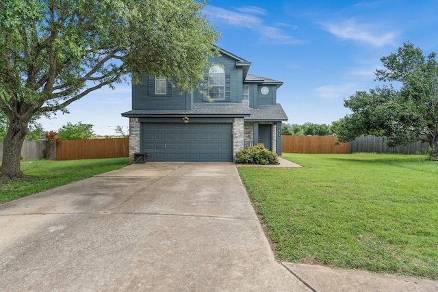 906 Pecos Cv, Leander, TX 78641 - traditional-style house with a garage, driveway, and a shingled roof
