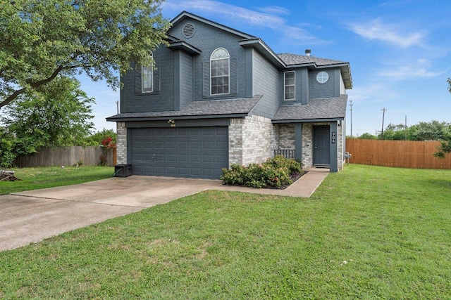 906 Pecos Cv, Leander, TX 78641 - traditional-style house with an attached garage, concrete driveway, and roof with shingles