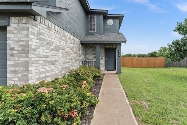 906 Pecos Cv, Leander, TX 78641 - view of exterior entry featuring a shingled roof