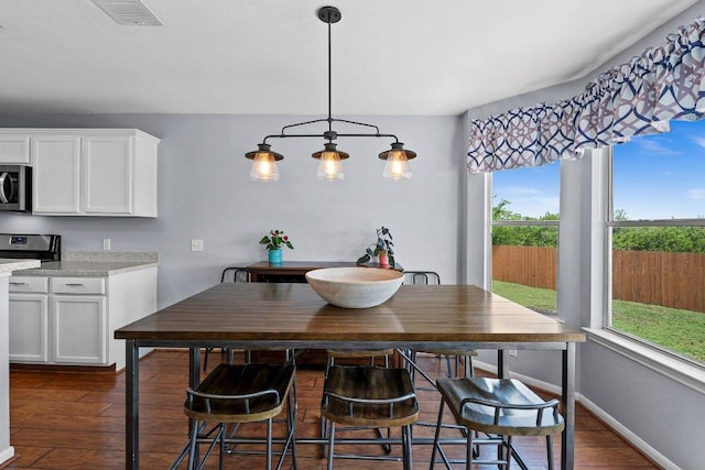 906 Pecos Cv, Leander, TX 78641 - dining area featuring dark wood-style floors