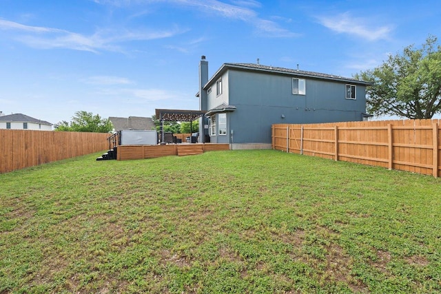 906 Pecos Cv, Leander, TX 78641 - back of property featuring a fenced backyard and a chimney