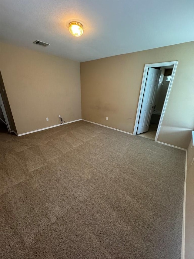 209 Lake Washington Dr, Kyle, TX 78640 - carpeted empty room featuring baseboards