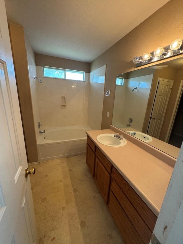 209 Lake Washington Dr, Kyle, TX 78640 - bathroom featuring vanity, tile patterned floors, and shower / bathtub combination