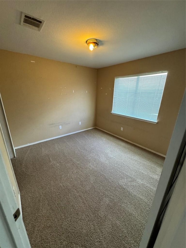 209 Lake Washington Dr, Kyle, TX 78640 - carpeted spare room featuring baseboards