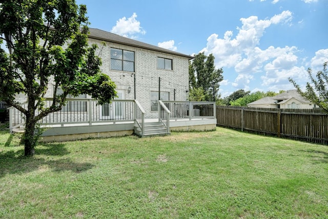 2801 Adelen Ln, Round Rock, TX 78664 - rear view of property with a fenced backyard, brick siding, and a deck