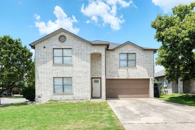 2801 Adelen Ln, Round Rock, TX 78664 - view of front facade featuring an attached garage, concrete driveway, a front yard, and brick siding