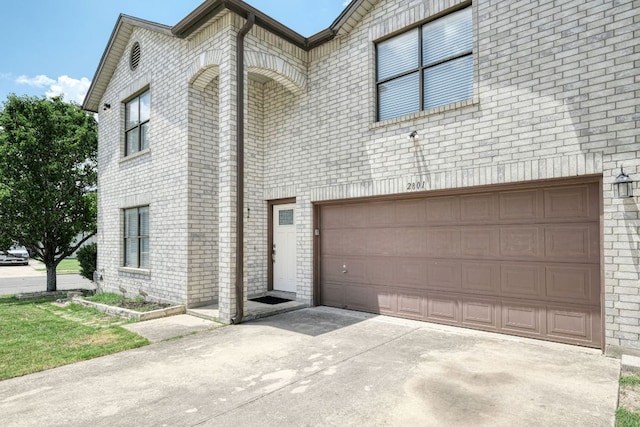2801 Adelen Ln, Round Rock, TX 78664 - multi unit property featuring an attached garage, concrete driveway, and brick siding