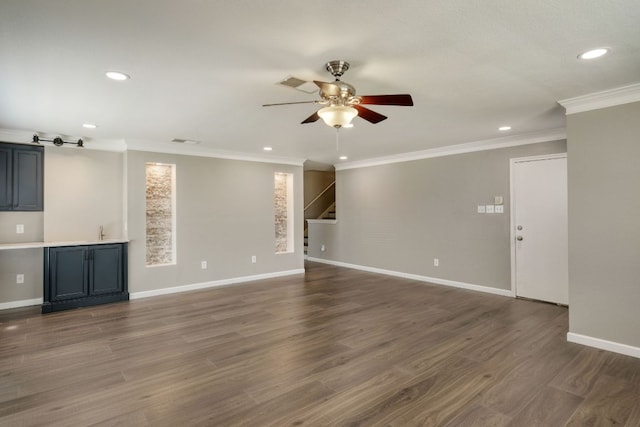2801 Adelen Ln, Round Rock, TX 78664 - unfurnished living room with ceiling fan, stairs, recessed lighting, crown molding, and wood finished floors