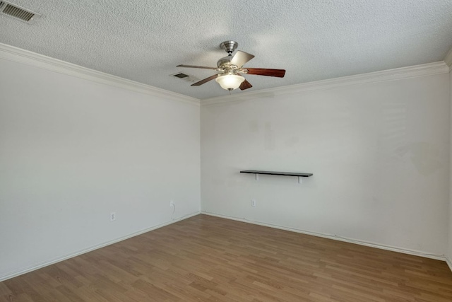 2801 Adelen Ln, Round Rock, TX 78664 - unfurnished room with wood finished floors, ceiling fan, ornamental molding, and a textured ceiling