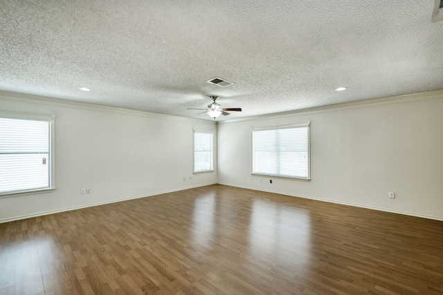 2801 Adelen Ln, Round Rock, TX 78664 - unfurnished room with crown molding, a textured ceiling, wood finished floors, ceiling fan, and recessed lighting