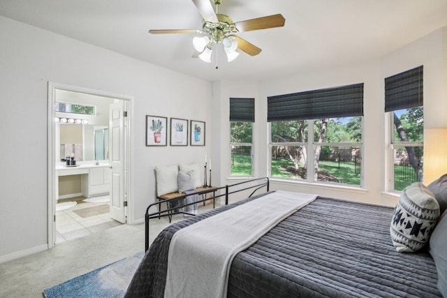 136 Trail Of The Flowers, Georgetown, TX 78633 - bedroom featuring carpet, a ceiling fan, and ensuite bath